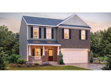 Charming two-story home with a brick facade, covered front porch, and attached two-car garage at 136 Mary Locke Way, Statesville, NC 28677