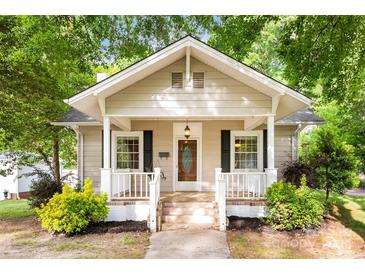 Charming home featuring a welcoming front porch with white columns and an inviting entrance at 204 S Elm St, Cherryville, NC 28021