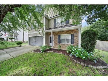 Charming home with stone accents, lush lawn, and beautiful landscaping at 2117 Seabrook Ln, Fort Mill, SC 29715