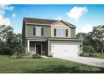 Charming two-story home featuring a two-car garage and a beautifully landscaped front yard with green grass at 3320 Burberry Dr, Gastonia, NC 28052