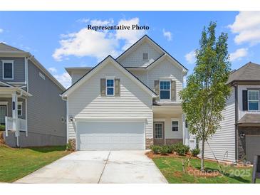 Charming two-story home featuring a two-car garage, tidy landscaping, and a welcoming front entrance at 1278 Langston Ln, Salisbury, NC 28144