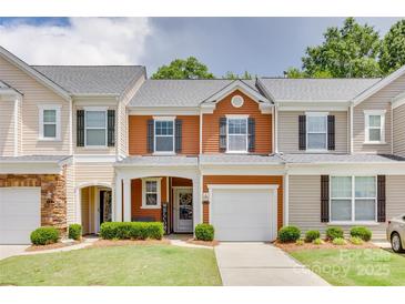 Charming townhome featuring a well-manicured lawn and a one-car garage and neutral colors at 244 River Clay Rd, Fort Mill, SC 29708
