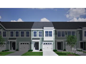 Charming townhouse featuring a one-car garage, a black front door, and light green siding at 2708 Lehigh Rd, Charlotte, NC 28208