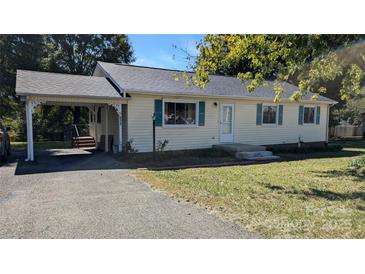 Charming single-story home with a carport and a well-maintained front yard at 824 S Laurel St, Lincolnton, NC 28092