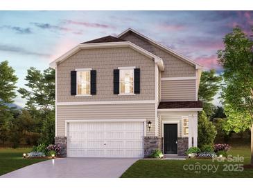 Two-story home featuring stone accents, white garage door, neutral siding and landscaped front yard at 1228 Hallman Branch Ln, Lincolnton, NC 28092