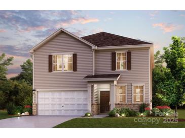 Charming two-story home with a well-manicured lawn and welcoming facade; a perfect place to call home at 710 Olde England Dr, Lincolnton, NC 28092