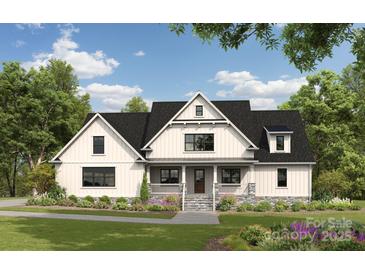 Charming two-story farmhouse with a stone foundation and a welcoming front porch at 762 Highway 274 Hwy, Clover, SC 29710