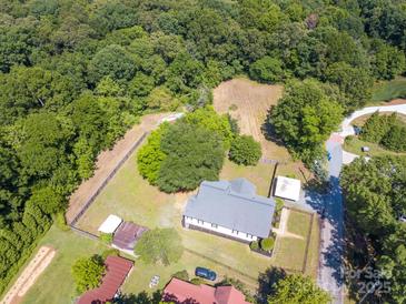 Expansive aerial view of the home and wooded lot showcasing privacy and outdoor space at 1111 Unionville Church Rd, Monroe, NC 28110