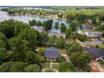 Stunning aerial view of lakefront property with mature trees and access to boating and recreational activities at 8024 Bradford Ln, Denver, NC 28037