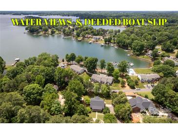Stunning aerial view showcasing waterfront homes and lush greenery with deeded boat slip access at 8024 Bradford Ln, Denver, NC 28037