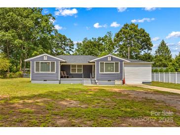 Charming single-story home with a well-maintained front yard and attached garage at 314 Euclid Ave, Statesville, NC 28677