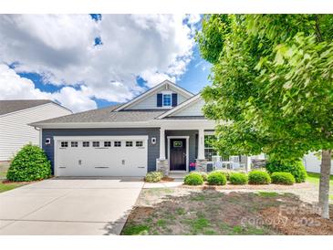 Charming single-Gathering home featuring a well-manicured lawn, two-car garage, and inviting curb appeal at 217 Barberry Dr, Belmont, NC 28012