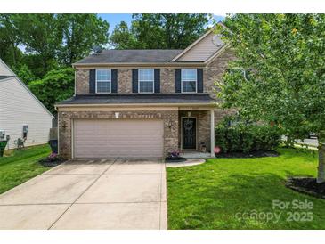 Traditional brick two-story home with a two-car garage and well-maintained front lawn at 16615 Crimson Sargent Dr, Charlotte, NC 28213