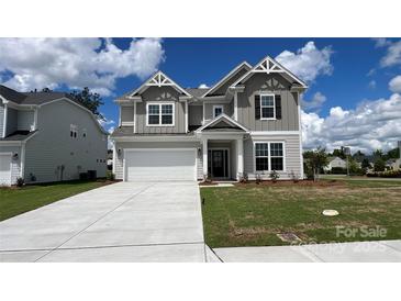 Charming two-story home featuring a manicured lawn and a spacious two-car garage, perfect for comfortable living at 2046 Sabra St # Cwo0006, Gastonia, NC 28054