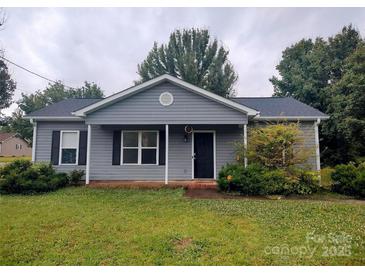 Charming single-story home featuring a well-maintained lawn and classic architectural details at 290 Greentree Dr, Rock Hill, SC 29730