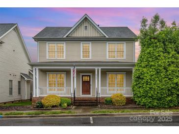 Charming two-story home with a welcoming front porch and well-maintained landscaping at 3906 Balsam St, Indian Trail, NC 28079