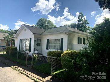Charming single-story home featuring white siding, green shutters, and a well-maintained front yard at 447 17Th St, Cramerton, NC 28032