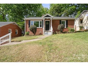 Charming brick home with a well-maintained lawn and a welcoming entrance, complete with a decorative wreath at 534 W Kingston Ave, Charlotte, NC 28203