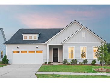 Charming single-Gathering home with a well-manicured lawn and a two-car garage at 4209 Pinekirk Dr # 374, Charlotte, NC 28269