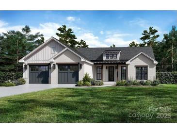 Charming single-story home with white brick, dark gray garage doors, and mature landscaping at 5190 Joseph Ct, Hickory, NC 28602