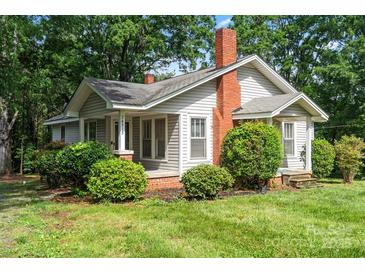 Charming single-Gathering home with a well-manicured front yard and inviting curb appeal at 24515 Saint Martin Rd, Albemarle, NC 28001