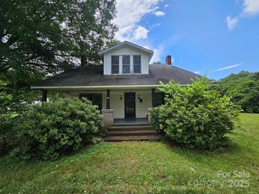 Charming home with a covered front porch and lush landscaping at 562 W Wilson Ave, Mooresville, NC 28115