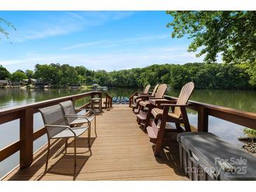 Private dock on the lake featuring a seating area and stunning water views at 408 Emerald Bay Dr, Salisbury, NC 28146