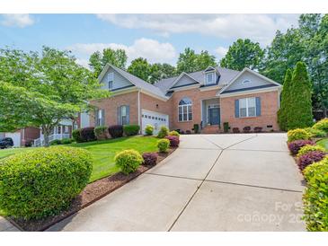 Charming brick home with a well-manicured lawn and driveway at 1643 Essex Hall Dr, Rock Hill, SC 29730