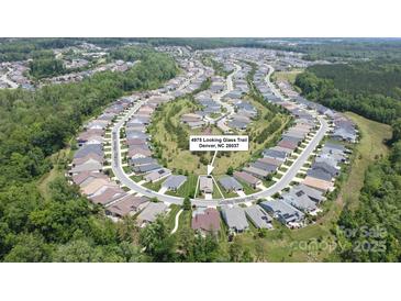 This is an aerial view of a home in a residential neighborhood with tree lined streets, and well maintained landscaping at 4975 Looking Glass Trl, Denver, NC 28037