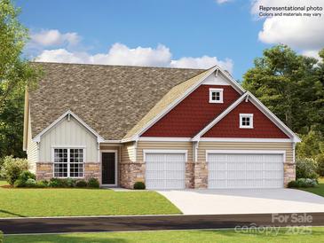 Charming single-Gathering home with a three-car garage and mixed siding exterior, nestled on a well-maintained lawn at 1516 Croydon St, Indian Land, SC 29707