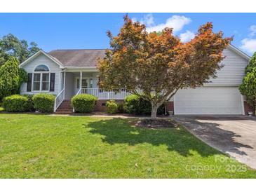 Charming single Gathering home with an attached garage and well-maintained lawn at 1028 Swaying Oats Dr, York, SC 29745