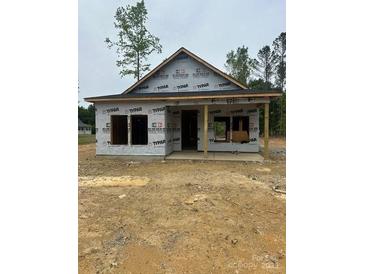 Unfinished home featuring a covered front porch, ready for your custom touches at 128 Loblolly Dr, Mount Gilead, NC 27306