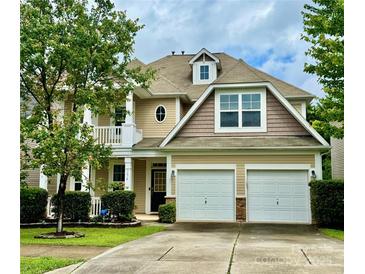 Charming two-story home with a well-manicured lawn and a two-car garage at 3678 Privette Rd # 349, Matthews, NC 28104