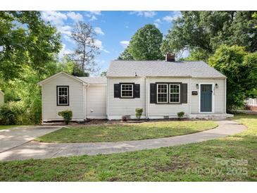Charming one-story home with black shutters, a gray roof, and a well-manicured front yard at 3920 Admiral Ave, Charlotte, NC 28205