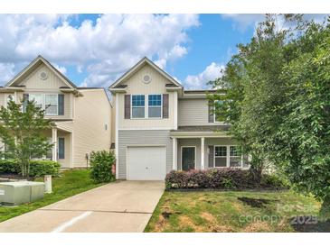 Charming two-story home with a well-manicured front yard and attached one-car garage at 1177 Bannockburn Ave, Rock Hill, SC 29732