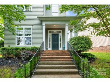 Charming home with a welcoming front entrance and well-maintained landscaping at 132 E Morehouse Ave, Mooresville, NC 28117