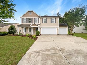 Charming two-story home with landscaped yard and a three car attached garage at 1814 Tradd Ave, Clover, SC 29710