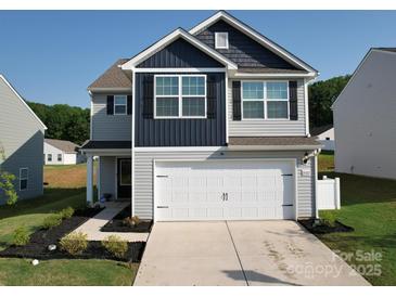 Charming two-story home featuring a two car garage, and manicured landscaping at 3322 Brighton Dr, Gastonia, NC 28052
