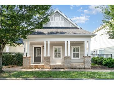 Charming exterior view of home with inviting front porch and manicured lawn at 6033 Bountiful St # 201, Belmont, NC 28012