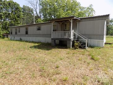 Exterior view of single-story home with a covered front porch at 868 Alexis High Shoals Rd, Dallas, NC 28034