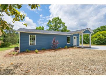Charming blue home with a landscaped yard and a welcoming front porch at 251 Hall Spencer Rd, Catawba, SC 29704