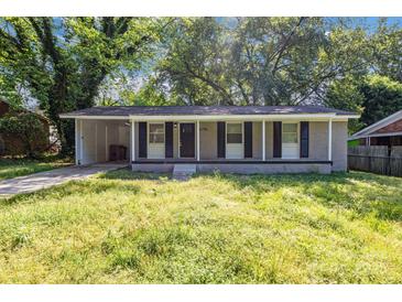 Charming single-story home with a covered front porch and a convenient carport at 5715 Coulee Pl, Charlotte, NC 28217