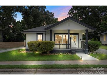 Charming bungalow with black and white trim, inviting porch, and manicured landscaping at 418 Link St, Fort Mill, SC 29715