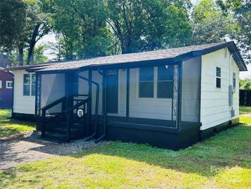 Attractive single-story home with a screened-in porch, freshly painted in neutral tones, and a well-maintained lawn at 20016 Walter Henderson Rd, Cornelius, NC 28031