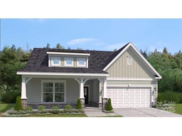 Charming single-Gathering home featuring stone accents and a two-car garage at 2045 Mantle Ridge Dr, Indian Trail, NC 28079