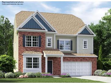 Charming two-story home featuring a brick facade, gable roof, and well-maintained landscaping at 4231 Skyboat Cir, Fort Mill, SC 29715