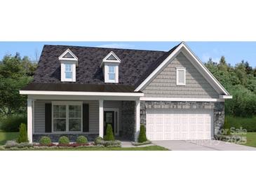 Charming single-Gathering home with stone accents, gray siding and a welcoming front porch at 5107 Raging Creek Dr, Indian Trail, NC 28079