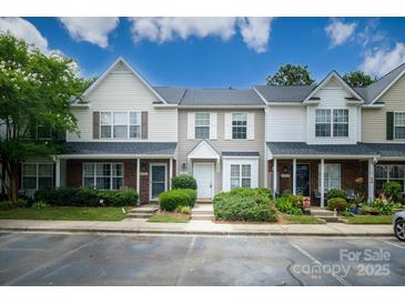 Charming townhome with a well-maintained lawn, inviting entrance, and convenient parking at 15042 Deshler Ct, Charlotte, NC 28273