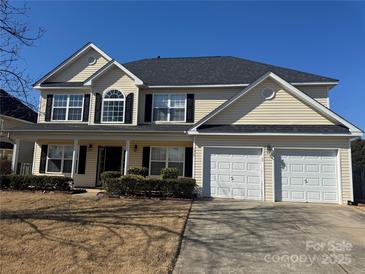 Charming two-story home features a two-car garage, well-manicured front yard, and classic architectural details at 170 Glenn Allen Rd, Mooresville, NC 28115