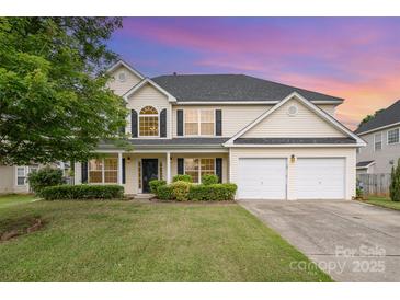 Charming two-story home featuring a well-manicured lawn, a two-car garage, and a classic facade at 170 Glenn Allen Rd, Mooresville, NC 28115